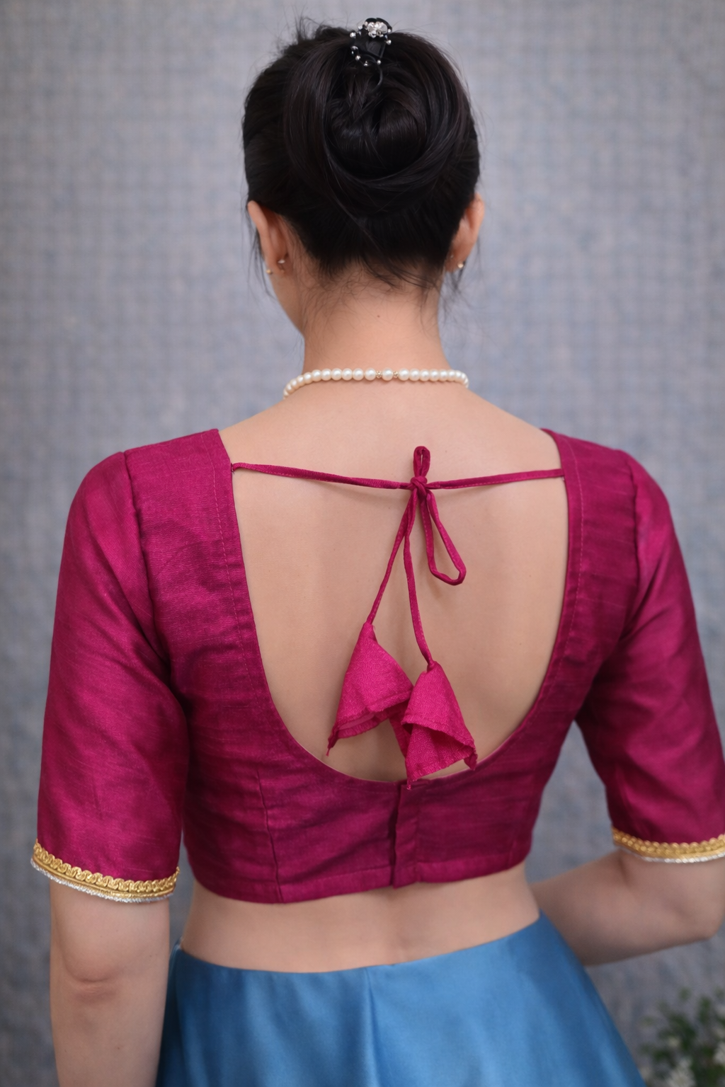 Magenta colour saree blouse with gold silver trim