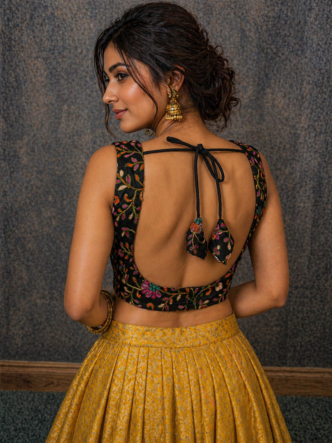 sleeveless black embroidered blouse